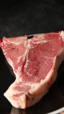 T-bone steak roast cut of meat juicy roast beef tasty snack fresh gourmet food background on the table rustic food top view copy space