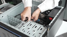 Closeup hand of computer hardware technician dissemble and  fixing computer PC. - Powered by Shutterstock - Get 15% off with code: PIKWIZARD15