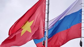 Vietnamese and Russian flags waving together in Moscow - Powered by Shutterstock - Get 15% off with code: PIKWIZARD15