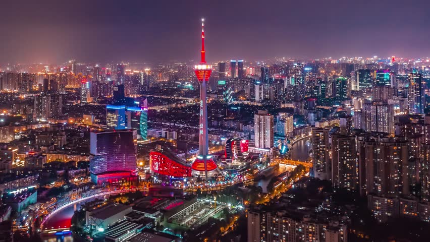 Stunning night view of Chengdu skyline featuring illuminated Panda Tower landmark with vibrant city lights, perfect for time lapse photography showcasing urban development.