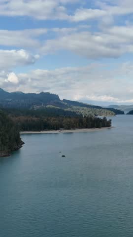 Majestic Lake and Forest Landscape Under Cloudy Skies in British Columbia, Canada