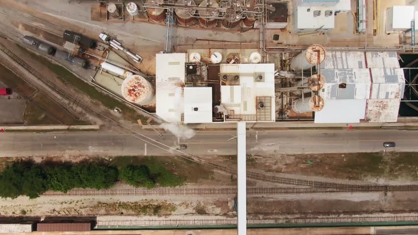 Aerial view of construction site with cranes and concrete structures under development.
