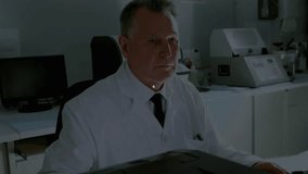 Senior scientist typing keyboard in lab generating network graph originating left spanning machines. Research, innovation, technology, data, analytics, precision, discovery - Powered by Shutterstock - Get 15% off with code: PIKWIZARD15