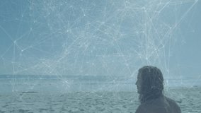 Beachgoer walking onto sandy shore, sitting while network overlay illustrating tech link over ocean. Coastline, tranquility, digital, connectivity, relaxation, nature, serenity - Powered by Shutterstock - Get 15% off with code: PIKWIZARD15