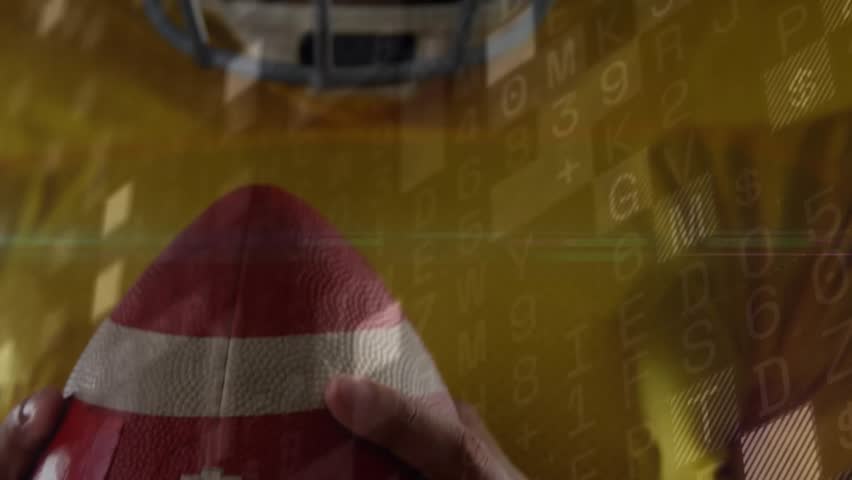 Football player gripping red football initiating tech overlays while camera rising toward facemask. Athlete, digital, futuristic, sports, motion, technology, innovation - Powered by Shutterstock - Get 15% off with code: PIKWIZARD15