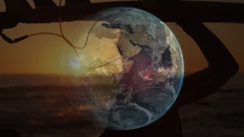 Male surfer on beach at sunset holding board as rotating globe overlay showing day-night tech demo. Ocean, sunset, silhouette, landscape, adventure, technology, specter - Powered by Shutterstock - Get 15% off with code: PIKWIZARD15