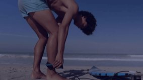 Surfer bending grabbing board leash with tech globe rotating network lines showing surf preparation. Beach, coastal, sporty, dynamic, modern, adventure, relaxation - Powered by Shutterstock - Get 15% off with code: PIKWIZARD15