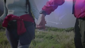 hiking couple holding hands across hill, starting drifting tech overlays visualizing trail data. Adventure, exploration, outdoor, technology, innovation, connection, landscape - Powered by Shutterstock - Get 15% off with code: PIKWIZARD15