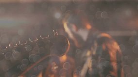 Guitarist entering and adjusting electric guitar tuning for music rehearsal with drifting bokeh. Musician, performance, stage, atmosphere, craftsmanship, melody, sound - Powered by Shutterstock - Get 15% off with code: PIKWIZARD15