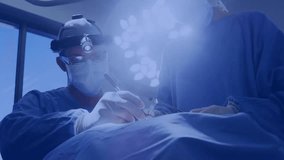 Surgeon making incision under surgical light, initiating social metrics showing health engagement. Medical, healthcare, operating, surgery, collaboration, innovation, digital - Powered by Shutterstock - Get 15% off with code: PIKWIZARD15