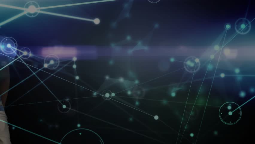 Football player watching spinning ball entering technology arena, catching ball while nodes pulsing. Athlete, strategic, futuristic, digital, action, virtual, connection - Powered by Shutterstock - Get 15% off with code: PIKWIZARD15