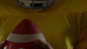 Football player adjusting grip and initiating sports analytics overlaying rising bars, trend lines. Athlete, competition, technology, visualization, performance, sport, data - Powered by Shutterstock - Get 15% off with code: PIKWIZARD15