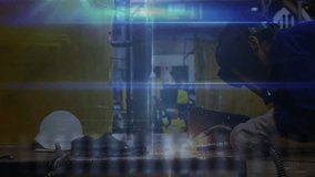 Workshop worker igniting torch on plate, generating sparks as code effect boosting manufacturing. Industrial, technology, craftsmanship, digital, mechanics, engineering, innovation - Powered by Shutterstock - Get 15% off with code: PIKWIZARD15