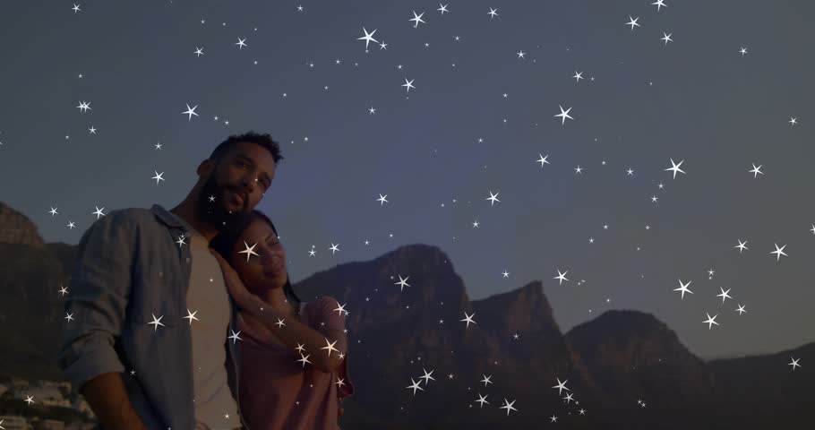 sky darkening initiating sparkle overlay around travel couple embracing appreciating mountain view. Romance, scenic, twilight, wanderlust, adventure, serenity, silhouette