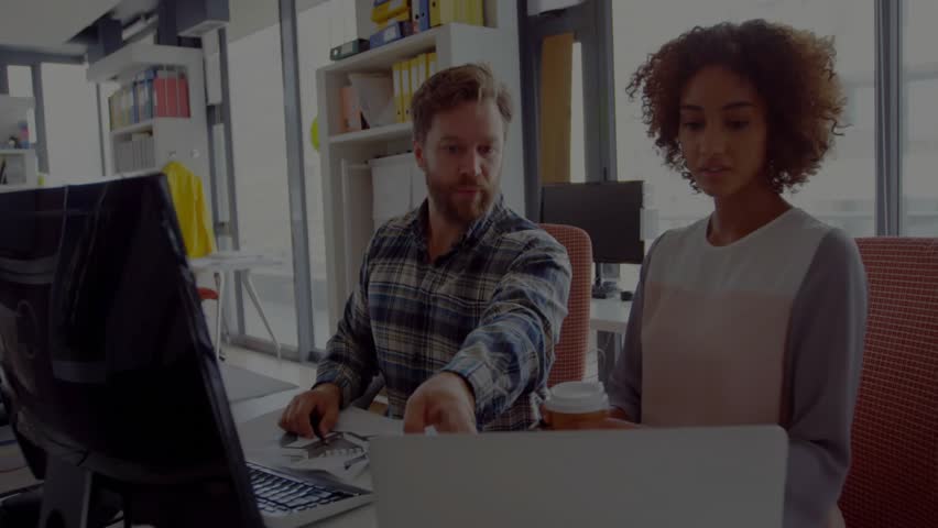 Man pointing at laptop screen activating code overlay as woman following in IT debugging session. Collaboration, teamwork, technology, coding, mentorship, innovation, modern - Powered by Shutterstock - Get 15% off with code: PIKWIZARD15
