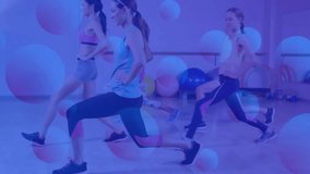 Instructor demonstrating forward lunge initiating group lunges in fitness with circles and dots. Fitness, group workout, exercise, activewear, studio, motivation, wellness - Powered by Shutterstock - Get 15% off with code: PIKWIZARD15