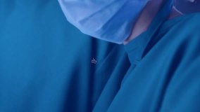 Camera zooming causing hexagon icons animating into medical network around surgeons faces. Medical, technology, innovation, healthcare, team, digital, professional - Powered by Shutterstock - Get 15% off with code: PIKWIZARD15