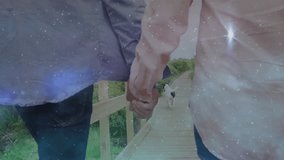 Tourists walking hand in hand on wooden walkway over marshland dog leading way sharing smile. Romantic, landscape, nature, leisure, tranquility, companionship, outdoor - Powered by Shutterstock - Get 15% off with code: PIKWIZARD15