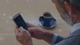 Senior man tapping white smartphone on wood desk and activating pulsing technology overlay graphics. Technology, innovation, interface, connectivity, senior, professional, digital - Powered by Shutterstock - Get 15% off with code: PIKWIZARD15