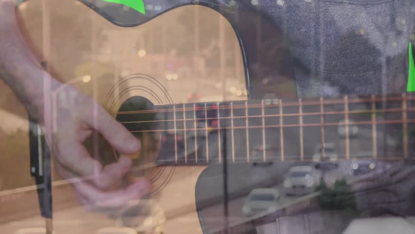 Strumming hand starting urban traffic overlay while performer alternating picking enhancing motion. Music, performance, artistry, rhythm, creativity, urban, multimedia