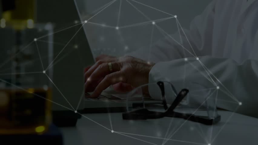 Senior scientist typing on laptop and activating data overlay while pondering periodic table in lab. Research, innovation, technology, data, analysis, science, laboratory - Powered by Shutterstock - Get 15% off with code: PIKWIZARD15