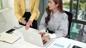 Adult Asian professional women working together on a business project in a modern office discussing strategy and data analysis for corporate growth - Powered by Shutterstock - Get 15% off with code: PIKWIZARD15