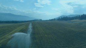 Irrigation arm entering frame causing watering field while hex icons appearing updating metrics. Precision agriculture, smart farming, sustainability, technology, environmental impact, crop - Powered by Shutterstock - Get 15% off with code: PIKWIZARD15