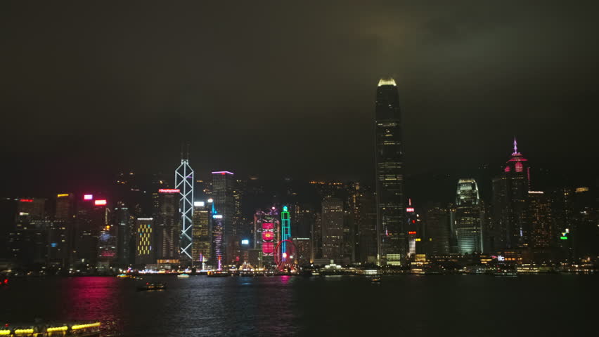 Hong Kong at night and boats in Victoria Harbour and Hong Kong Central, timelapse 4k