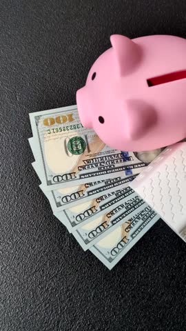 House, buying or selling real estate, concept background with money and piggy bank. Real estate, background for agency or for rent