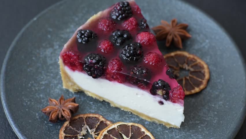 Pie, cheesecake with raspberries and blackberries, mascarpone cheese. Piece of cheesecake, sweet dessert with berries