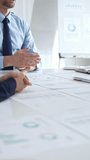 Business partnership success concept with handshake in modern office, financial charts, graphs and laptop on desk representing teamwork, agreement and corporate growth - Powered by Shutterstock - Get 15% off with code: PIKWIZARD15