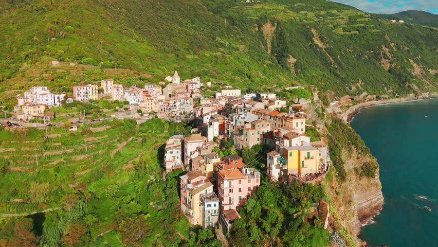 Aerial view of the Corniglia town in the famous Cinque Terre, Italian Riviera, Liguria, Italy. Stunning historic village with colorful buildings nestled between cliffs and the Ligurian Sea. 