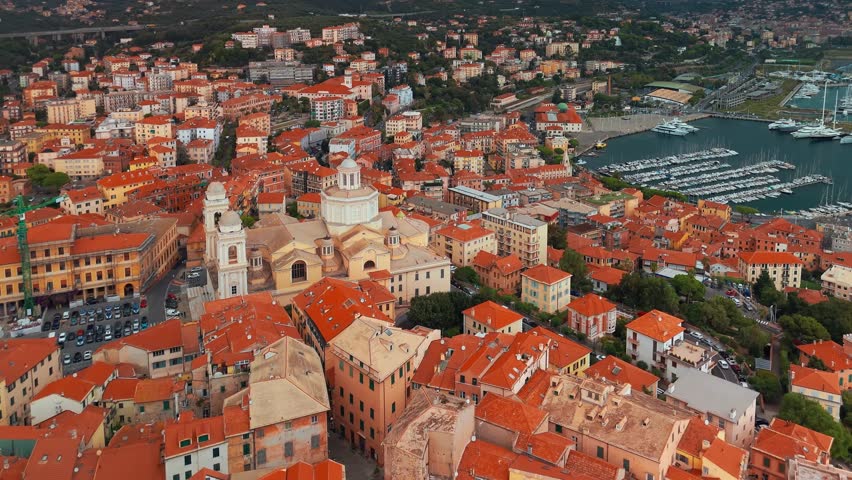 Aerial view of Porto Maurizio town in Liguria, northern Italy. Prominent Cathedral Basilica of Saint Maurice and Companions Martyrs dominates the historic coastal landscape of Imperia region.