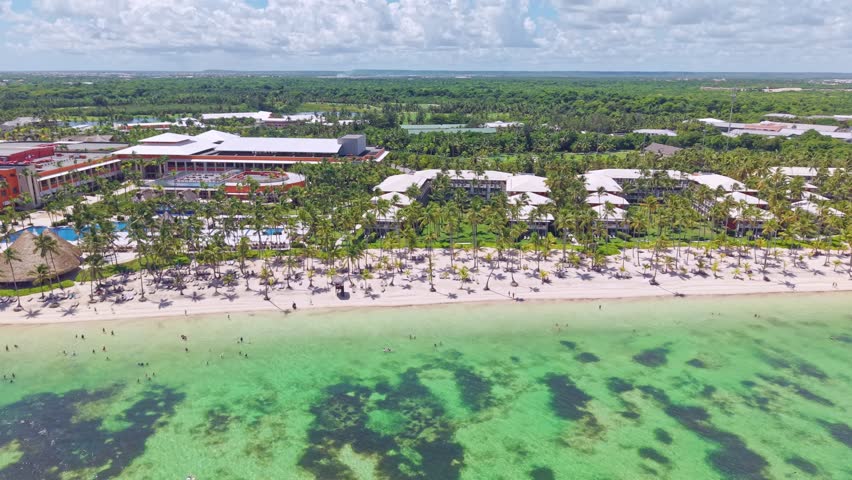 Palm-fringed With White Sand Shores At Punta Cana On The Easternmost Tip Of The Dominican Republic. Aerial Drone Shot