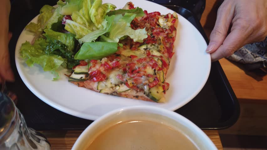 Fresh vegetarian Pizza with green leaves side salad