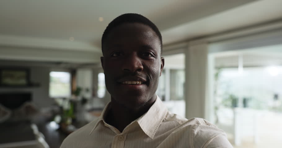 Face, business man or video recording in home for virtual property tour, house viewing or promotion. Real estate agent, black person and live streaming to showcase mortgage listing and new apartment