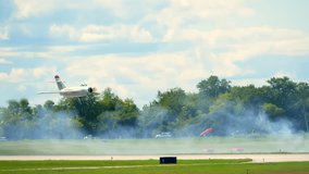 Close up of MiG-17 fighter jet flying at airshow. Aviation heritage, Cold War history, military technology, aerospace engineering. Waukegan  - Powered by Shutterstock - Get 15% off with code: PIKWIZARD15