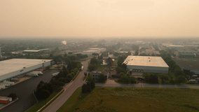 Industrial area with warehouses and transportation infrastructure in the suburbs under the gloomy cloudy sky.  - Powered by Shutterstock - Get 15% off with code: PIKWIZARD15
