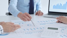 Business people having a financial meeting, discussing company strategy, reviewing data analysis, and planning future growth using charts and reports - Powered by Shutterstock - Get 15% off with code: PIKWIZARD15