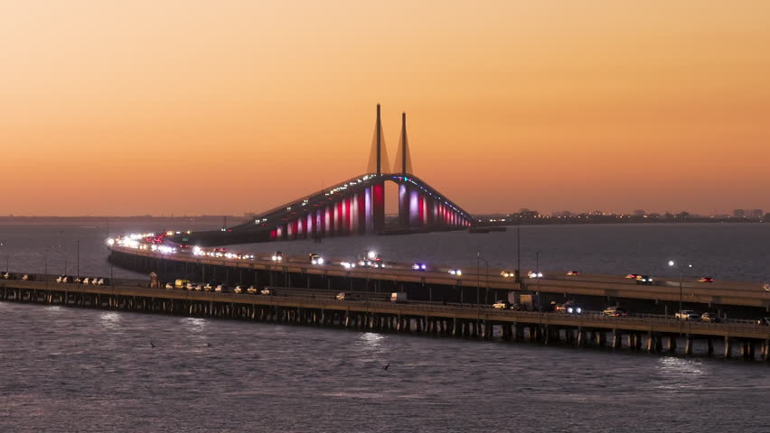 Cars driving at night on Sunshine Skyway Bridge over Tampa Bay in Florida. Transportation infrastructure in America