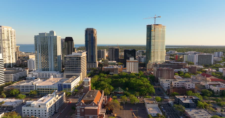 Urban landscape of St Petersburg downtown in Florida, USA. Mix of residential and commercial buildings in a modern American coastal city.