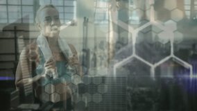 woman gesturing activating interface showing DNA hologram hex overlay, coach analyzing health data. Futuristic, biotechnology, innovation, health, digital, science, visualization - Powered by Shutterstock - Get 15% off with code: PIKWIZARD15