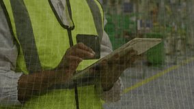 Warehouse manager tapping tablet creating holographic soccer ball overlay mapping metrics in aisle. Technology, analytics, innovation, industrial, teamwork, data visualization, logistics - Powered by Shutterstock - Get 15% off with code: PIKWIZARD15