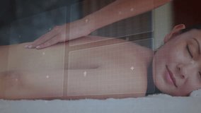 Client lying on spa bed, therapist pressing back starting data panels rotating for health metric. Wellness, technology, relaxation, health, innovation, diagnosis, therapy - Powered by Shutterstock - Get 15% off with code: PIKWIZARD15