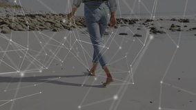 Barefoot woman pressing wet sand and walking shoreline, technology overlay expanding over beach. Serenity, connectivity, coastal, contemporary, exploration, tranquility, digital - Powered by Shutterstock - Get 15% off with code: PIKWIZARD15