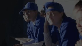 Adult female baseball team sitting bench blue helix entering sweeping across showing sports tech. Athletes, teamwork, innovation, technology, training, fitness, digital - Powered by Shutterstock - Get 15% off with code: PIKWIZARD15