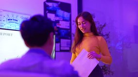 Product developers actively discuss with package designers, working all night to brainstorm ideas, sharing insights, and checking screen and paper graphic charts in the office at night. - Powered by Shutterstock - Get 15% off with code: PIKWIZARD15