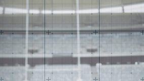 Rugby ball tip entering frame sliding rotating onto kicking tee under targeting grid for kick aim. Sports equipment, outdoor, minimalist, precision, competition, stadium, athletic - Powered by Shutterstock - Get 15% off with code: PIKWIZARD15