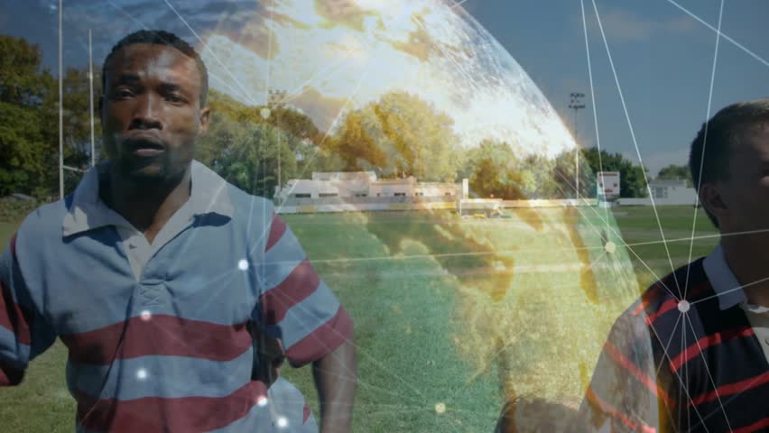 Rugby players sprinting on sports pitch with globe overlay as incoming ball sparking fight for ball. Athletics, competition, digital, innovation, teamwork, sportsmanship, outdoor - Powered by Shutterstock - Get 15% off with code: PIKWIZARD15