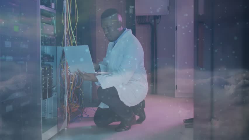 Network tech kneeling by rack running tests tracing cable to port with data overlay restoring link. Technology, networking, data, infrastructure, electronics, connectivity, cybersecurity - Powered by Shutterstock - Get 15% off with code: PIKWIZARD15